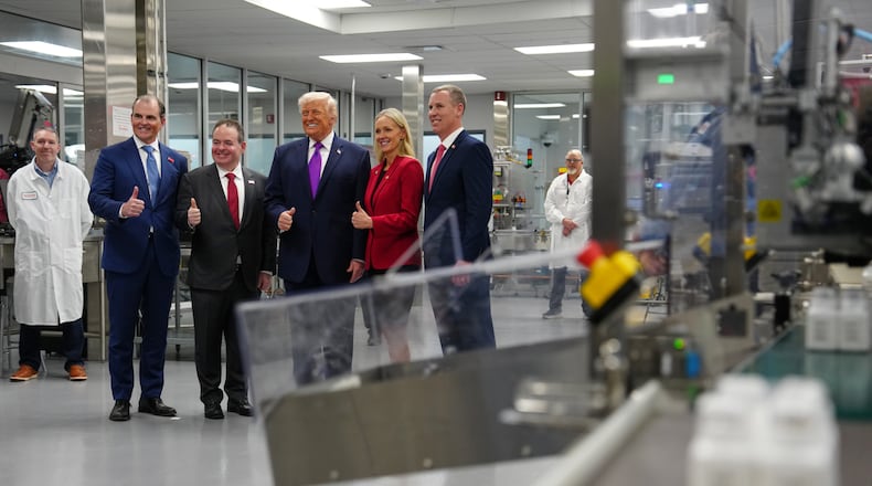 President Donald Trump poses for a photo during a visit to Thermo Fisher Scientific, Wednesday, March 11, 2026, in Cincinnati. (AP Photo/Julia Demaree Nikhinson)