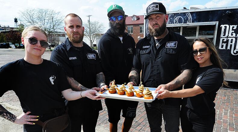 Death Grip Donuts is collaborating with Uncle Boof’s World Famous Pancake Mix for a “Locals Only” donut featuring a traditional vanilla donut with maple glaze, three mini pancakes and a dollop of cinnamon butter that’s served with a pipette of maple syrup. Pictured left to right is Kylie Bauer, Anthony Brewer, Dexter Clay, Cameron Hill and Lainey Lucas. MARSHALL GORBY\STAFF