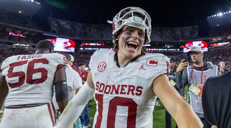Oklahoma quarterback John Mateer (10) celebrates a 23-21 win over Alabama in an NCAA college football game, Saturday, Nov. 15, 2025, in Tuscaloosa, Ala. (AP Photo/Vasha Hunt)