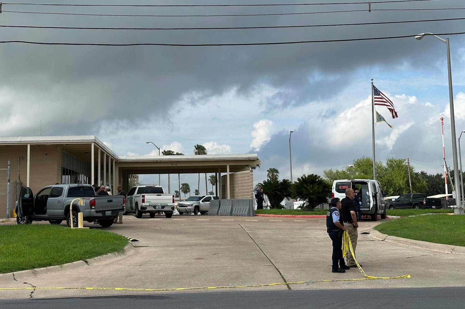 Officials work the scene of a shooting at a Border Patrol facility in McAllen, Texas, Monday, July 7, 2025. (AP Photo/Valerie Gonzalez)