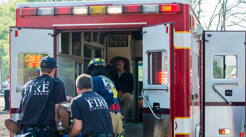 Fairborn medics and a firefighter participate in an exercise at Wright-Patterson Air Force Base in May 2015. CONTRIBUTED