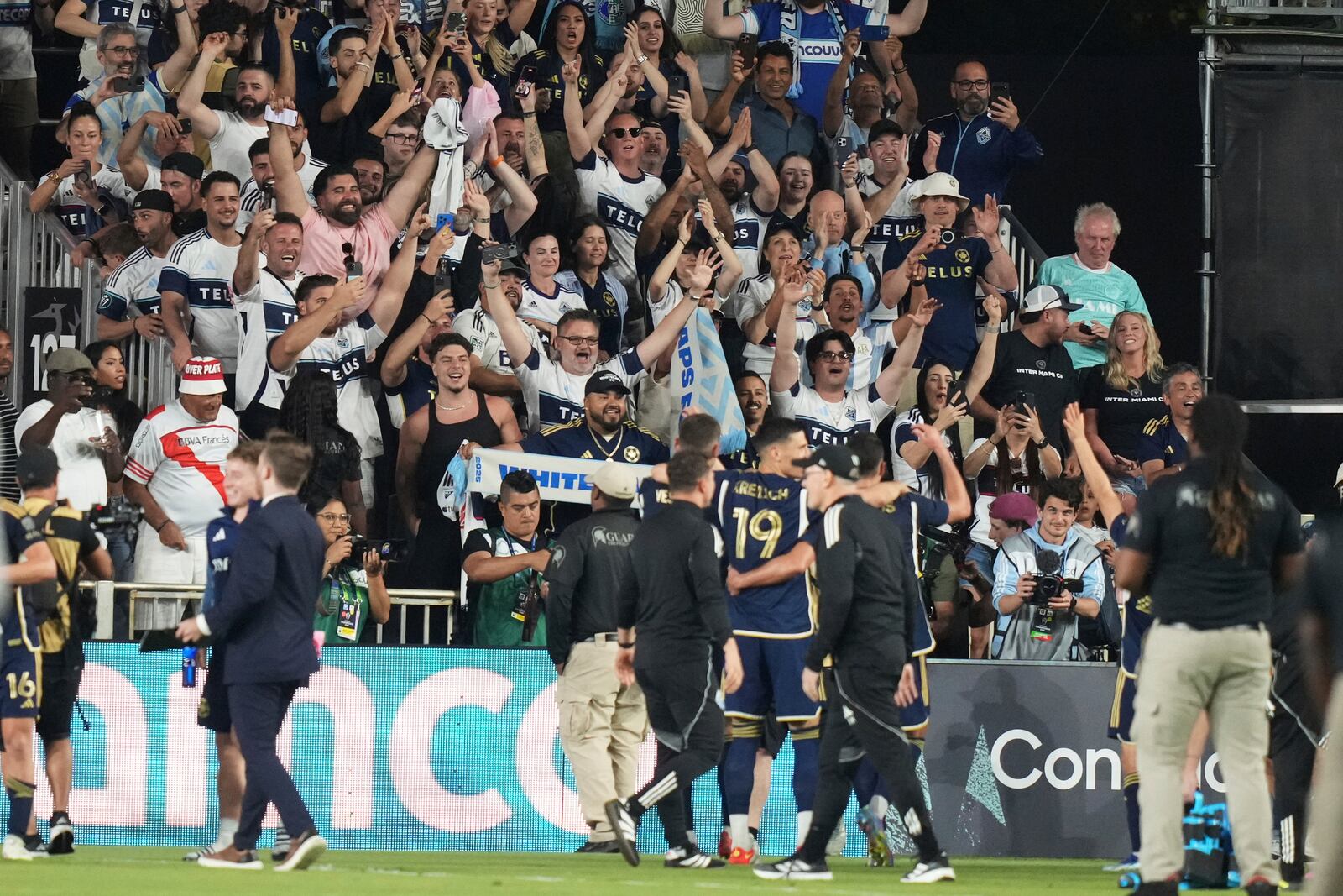 Vancouver Whitecaps fans cheer after a CONCACAF Champions Cup second-leg semifinal soccer match between Inter Miami and the Vancouver Whitecaps, Wednesday, April 30, 2025, in Fort Lauderdale, Fla. (AP Photo/Lynne Sladky)