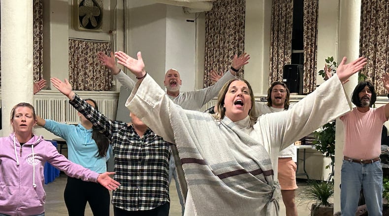 Annette Turner, portraying Mary Magdalene, rehearses a song she sings lead on backed by fellow cast members during a rehearsal of "Acts," a new original musical based on the Bible book and the story of the Apostles coming to the John Legend Theater.