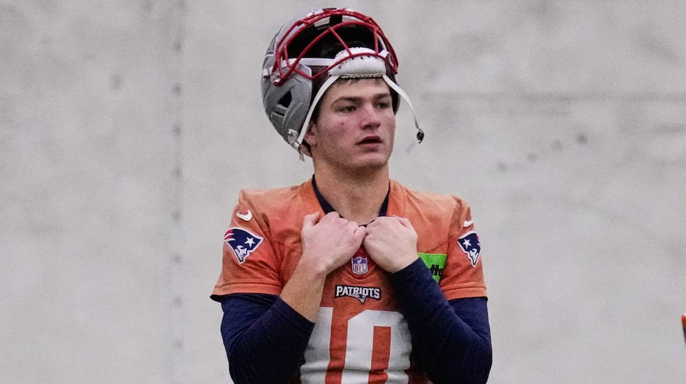 New England Patriots quarterback Drake Maye watches teammates during an NFL football availability, Thursday, Jan. 29, 2026, in Foxborough, Mass. (AP Photo/Charles Krupa)