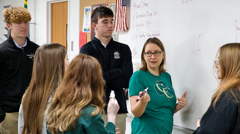 Kelly Brown teaches a chemistry class at Catholic Central High School Tuesday, March 5, 2024. BILL LACKEY/STAFF