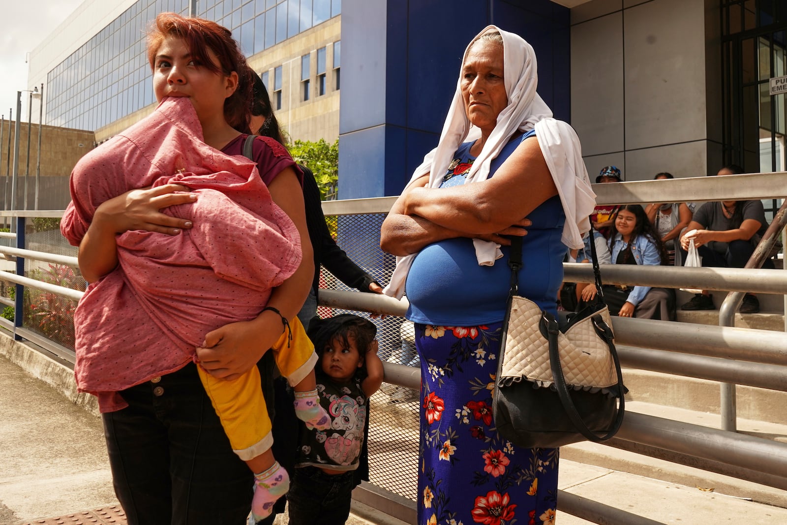 Relatives of Alejandro Henriquez and Jose Angel Perez wait outside the courts during their hearing in Santa Tecla, El Salvador, Friday, May 30, 2025. The National Civil Police arrested them for protesting near the presidnetial residence. (AP Photo/Salvador Melendez)