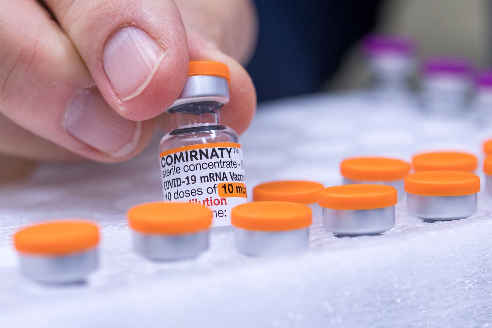 FILE - An ampoule of the vaccine "Comirnaty" for children from the manufacturer Biontech/Pfizer is pictured in a pharmacy in Duesseldorf, Germany, Dec. 13, 2021. (Marius Becker/dpa via AP, File)