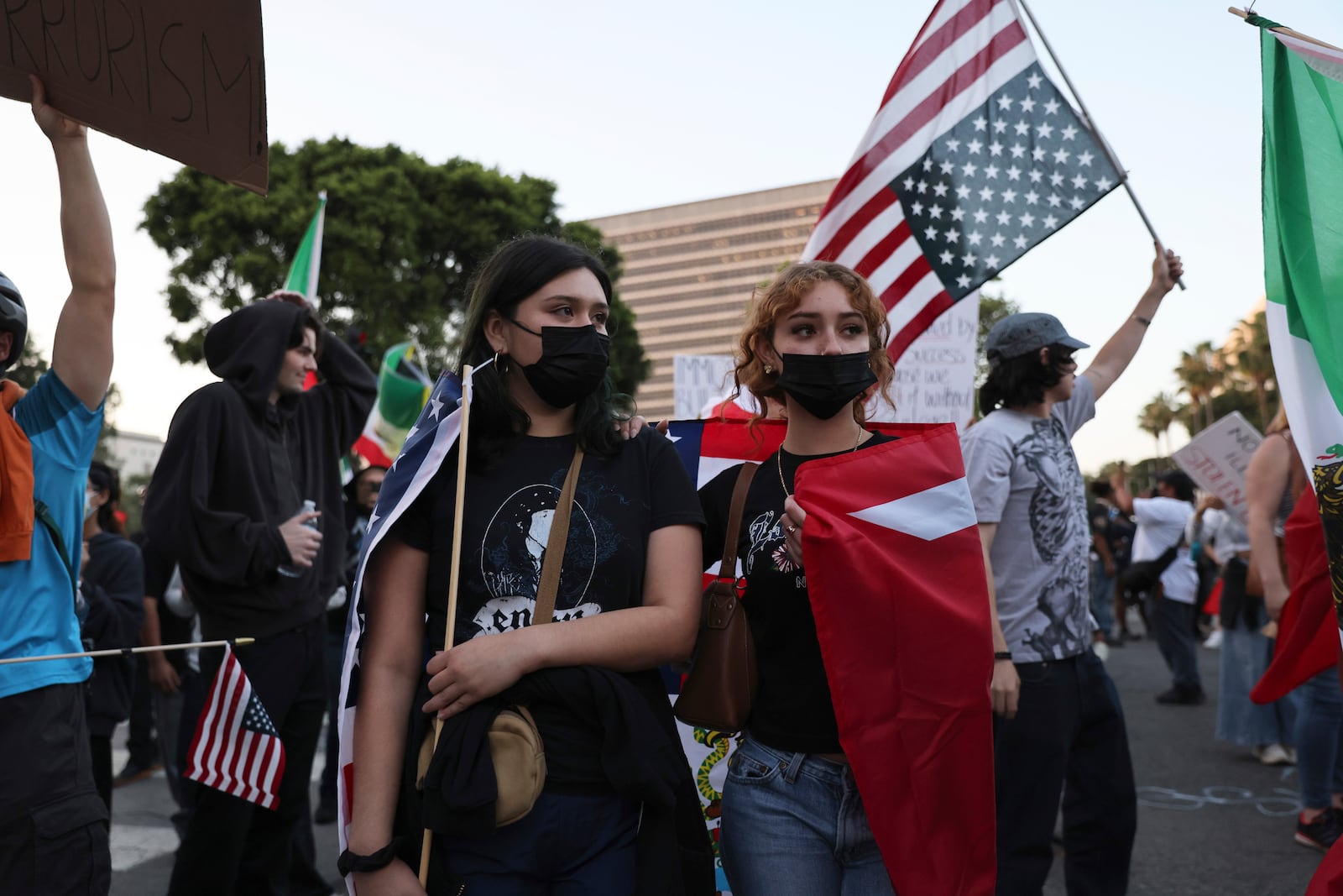 Protesters rally during a demonstration in response to a series of United States Immigration and Customs Enforcement (ICE) raids throughout the country, in Los Angeles, Calif., Thursday, June 12, 2025. (Gabrielle Lurie/San Francisco Chronicle via AP)