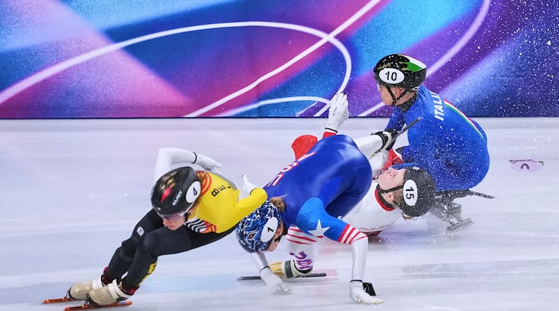 Kamila Sellier of Poland falls during the women's 1,500 meters short track speedskating quarterfinal at the 2026 Winter Olympics, in Milan, Italy, Friday, Feb. 20, 2026. (AP Photo/Stephanie Scarbrough)
