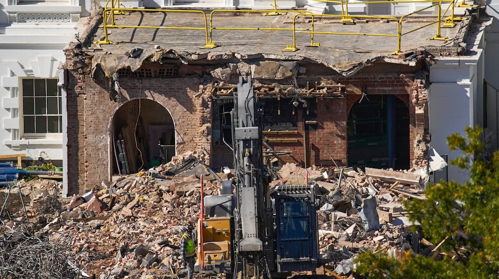 FILE - A worker walks among debris from a largely demolished part of the East Wing of the White House, Oct. 23, 2025, in Washington, before construction of a new ballroom. (AP Photo/Jacquelyn Martin)