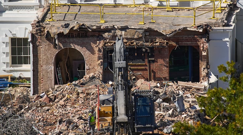 FILE - A worker walks among debris from a largely demolished part of the East Wing of the White House, Oct. 23, 2025, in Washington, before construction of a new ballroom. (AP Photo/Jacquelyn Martin)