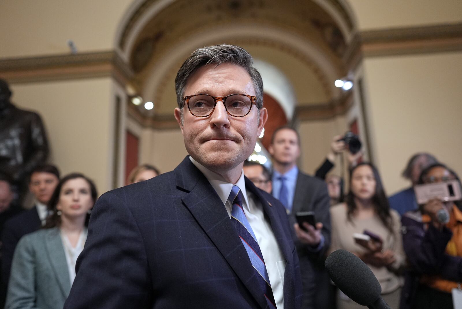 Speaker of the House Mike Johnson, R-La., talks to reporters just after House Republicans narrowly approved their budget framework, at the Capitol in Washington, Thursday, April 10, 2025. (AP Photo/J. Scott Applewhite)