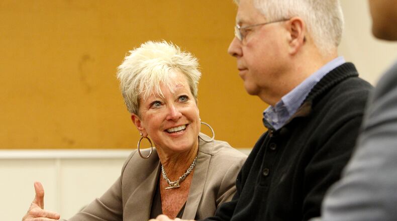 Deb Norris, left, plans to leave Sinclair Community College in Dayton for a new job. LISA POWELL / STAFF