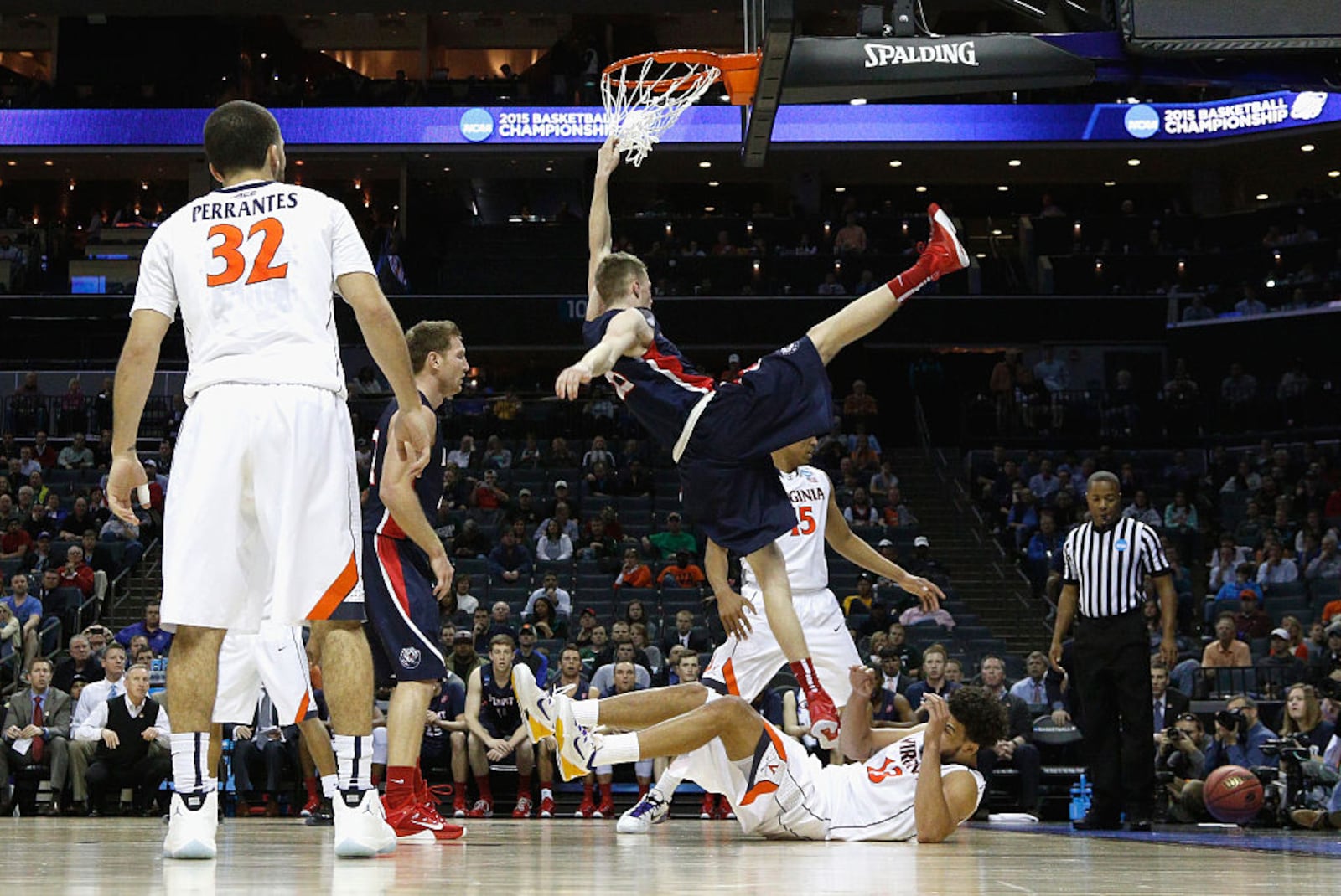 CHARLOTTE, NC - MARCH 20: Evan Bradds #35 of the Belmont Bruins falls at the basket against the Virginia Cavaliers during the second round of the 2015 NCAA Men’s Basketball Tournament at Time Warner Cable Arena on March 20, 2015 in Charlotte, North Carolina. (Photo by Bob Leverone/Getty Images)