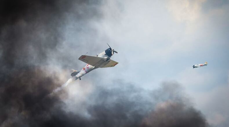 The flight team Tora Tora Tora, which re-enacts the Japanese invasion of Pearl Harbor, performs at the Dayton Air Show on Saturday, June 22, 2024. JIM NOELKER / STAFF