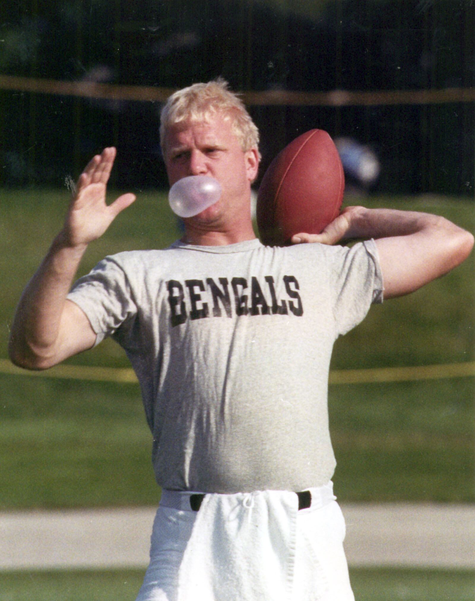 Bengals training camp at Wilmington College. Boomer Esiason blows bubbles while throwing. 7-25-1990