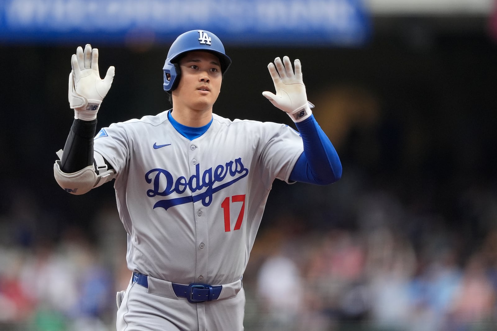 Los Angeles Dodgers' Shohei Ohtani gestures as he rounds the bases after hitting a solo home run during the first inning of a baseball game against the Milwaukee Brewers, Tuesday, July 8, 2025, in Milwaukee. (AP Photo/Aaron Gash)