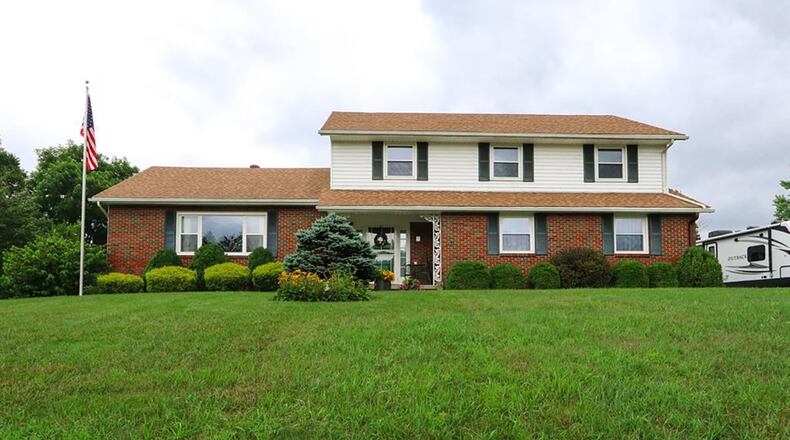 Boasting a partially finished, walkout basement, this brick-and-vinyl home with about 3,080 sq. ft. of living space features a first-floor guest bedroom. CONTRIBUTED PHOTO BY VICKIE KAPNAS