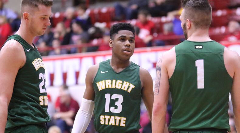 Wright State’s Malchi Smith (13), Parker Ernsthausen (left) and Bill Wampler during Thursday night’s game at Detroit Mercy. PHOTO COURTESY OF WRIGHT STATE