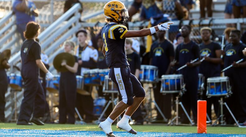 Springfield High School senior Duncan Bradley III points to the crowd after scoring a touchdown during their game against Cleveland St. Ignatius on Friday, Aug. 18 in Springfield. Michael Cooper/CONTRIBUTED