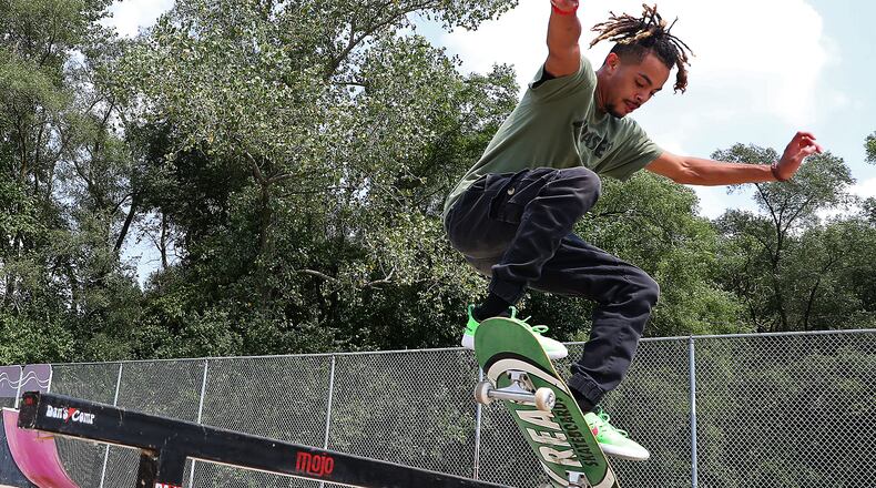 Matthew "Chewy" Perez shows off his skateboarding skills Wednesday at the New Carlisle Skate Park. Perez and other volunteers have started cleaning up the skate park, which had been neglected in recent years and now a skateboard competition will be held at the park September 5th. BILL LACKEY/STAFF