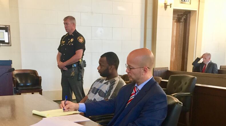 Tyrez Boyd sits with his attorney in Clark County Common Pleas Court Thursday. STAFF PHOTO
