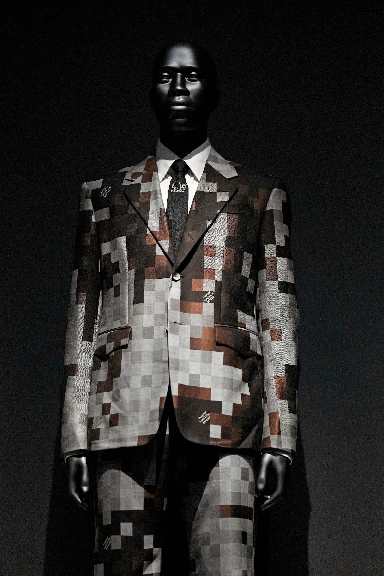 A suit designed by Pharrell Williams for Louis Vuitton is displayed at the Metropolitan Museum of Art's Costume Institute exhibition, "Superfine: Tailoring Black Style," on Saturday, May 3, 2025, in New York. (Photo by Charles Sykes/Invision/AP)