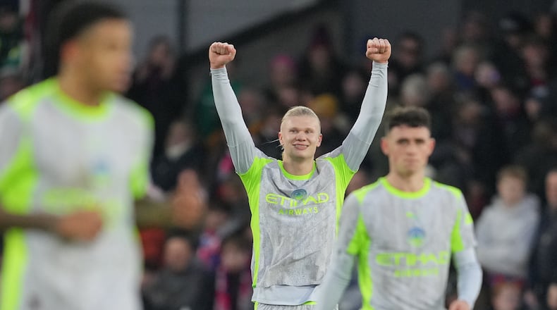Manchester City's Erling Haaland celebrates after scoring his side's third goal during the English Premier League soccer match between Crystal Palace and Manchester City in London, Sunday, Dec.14, 2025. (AP Photo/Kin Cheung)