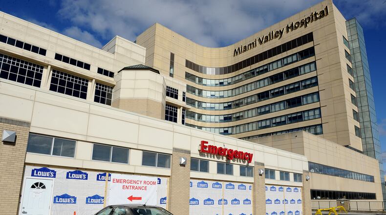 The Miami Valley Hospital Emergency Room enclosed its front canopy so it would have extra space to triage high patient volumes. MARSHALL GORBY\STAFF