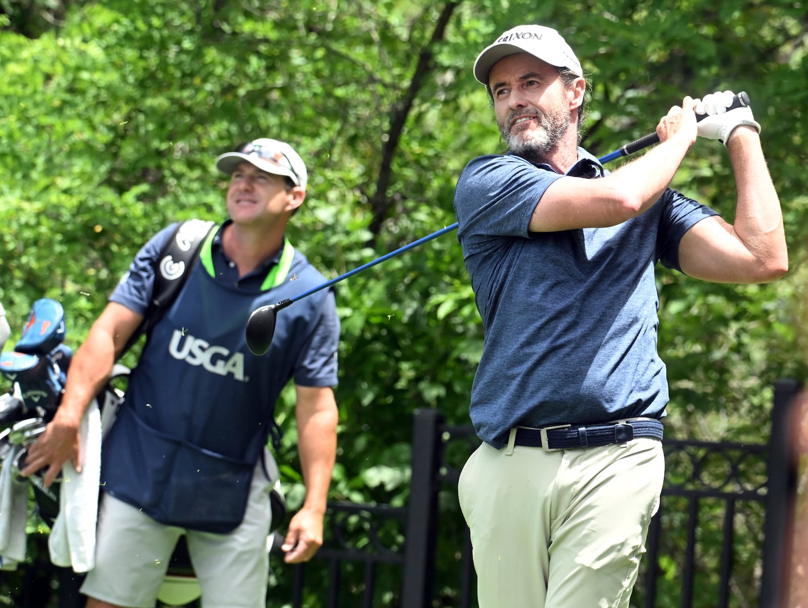Mark Hensby, right, hits off of the tee on the 18th hole during the first session of the first day at the U.S. Senior Open Championship at Broadmoor Golf Club in Colorado Springs, Colo., Thursday, June 26, 2025. (Jerilee Bennett/The Gazette via AP)