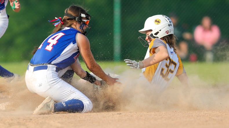 Kenton Ridge freshman Kendall Massies slides against Marengo Highland 5-0 in a Division II regional semifinal at Wright State University on May 24, 2023. Michael Cooper/CONTRIBUTED