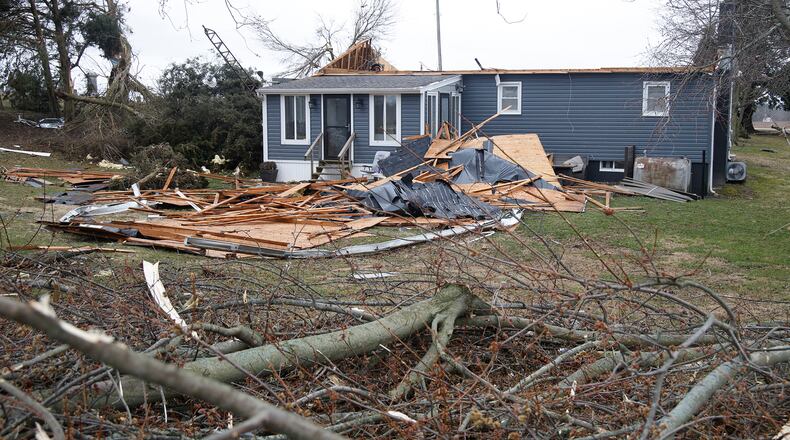 Damage to a house caused by Wednesday's tornado along Fletcher Pike. BILL LACKEY/STAFF