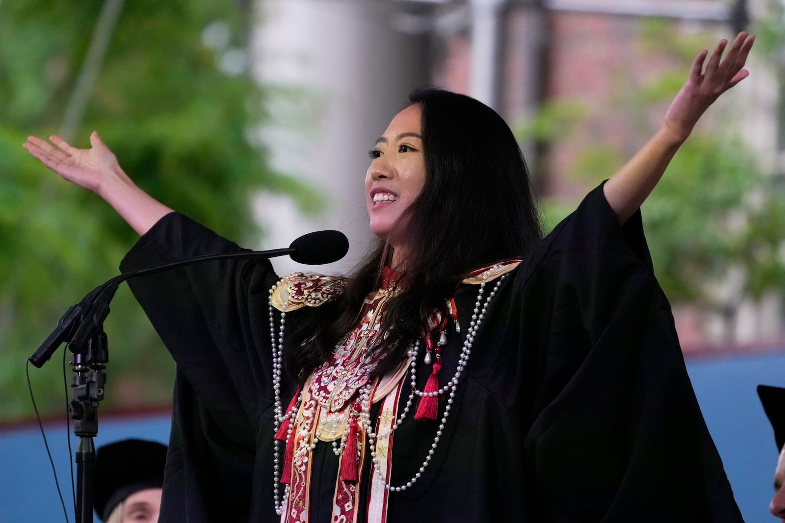 Yurong "Luanna" Jiang addresses classmates during commencement ceremonies at Harvard University, Thursday, May 29, 2025, in Cambridge, Mass. (AP Photo/Charles Krupa)
