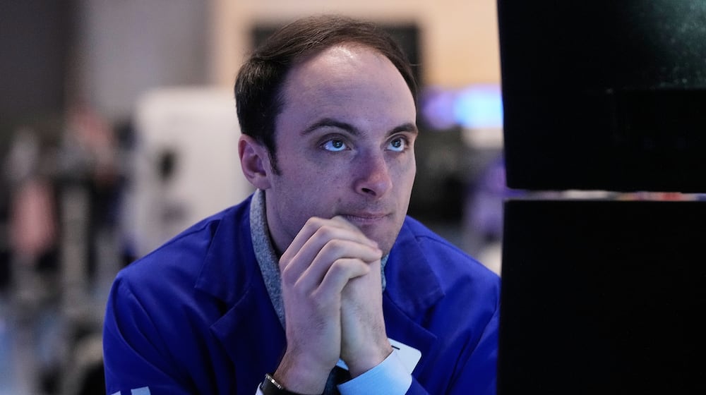 Specialist Joseph Maguire works at his post on the floor of the New York Stock Exchange, Tuesday, Feb. 3, 2026. (AP Photo/Richard Drew)