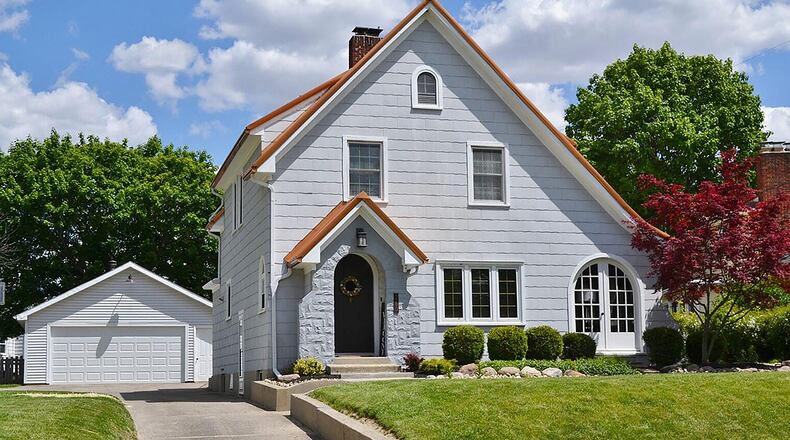 The front of this 2-story features a long concrete driveway leading to a detached, 2-car garage. The 3-bedroom home has a finished basement and a 40-year metal roof. CONTRIBUTED PHOTO