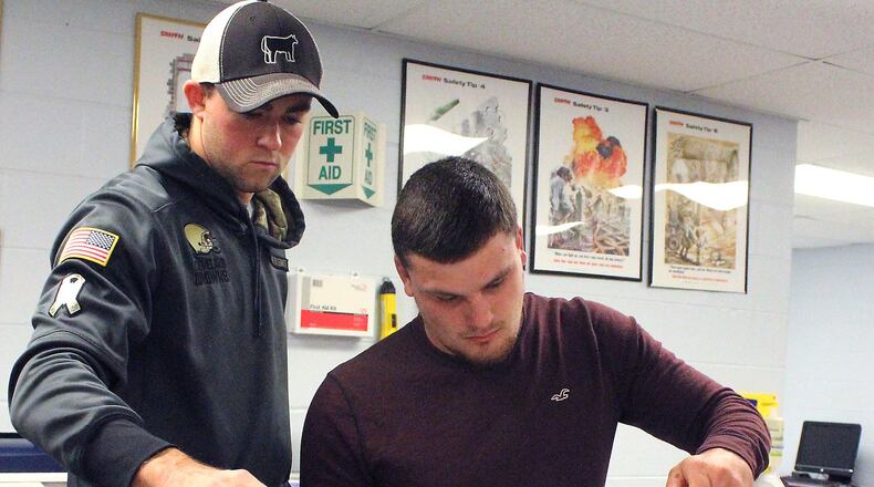 Clark State College will host the 2022 Community College Alliance for Agriculture Advancement Annual Conference on Sept. 18-20. Here, students (left) Michael Schmid and Tyler Mason performed an experiment in a Soil Science class a few years ago. FILE