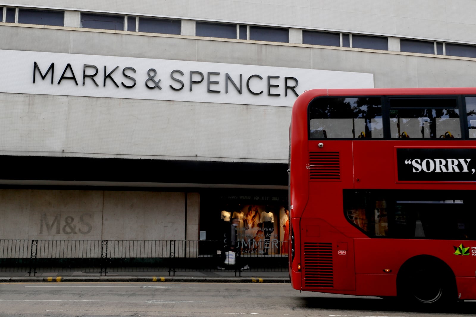 FILE - A bus passes a branch of Marks and Spencer in London, Tuesday, Aug. 18, 2020. (AP Photo/Kirsty Wigglesworth, file)