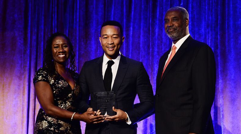 NAACP LDF president and director-counsel Sherrilyn Ifill, musician John Legend and LDF board chair Gerald Adolph on stage during the the LDF 31th National Equal Justice Awards Dinner at Cipriani 42nd Street on November 2, 2017 in New York City. (Photo by Dave Kotinsky/Getty Images for NAACP Legal Defense and Educational Fund, Inc.)