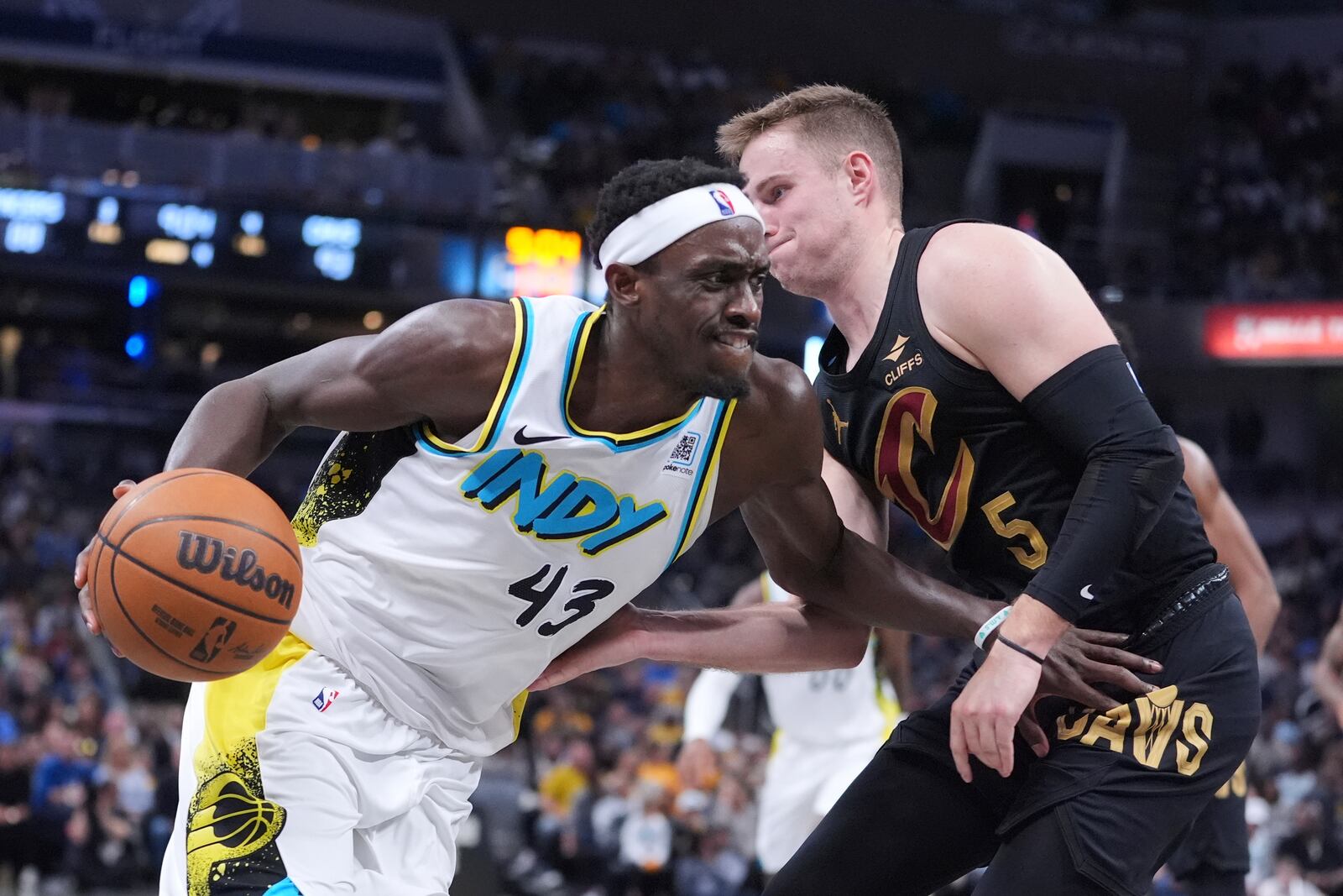 Indiana Pacers forward Pascal Siakam (43) drives on Cleveland Cavaliers guard Sam Merrill (5) during the second half of an NBA basketball game in Indianapolis, Thursday, April 10, 2025. (AP Photo/Michael Conroy)