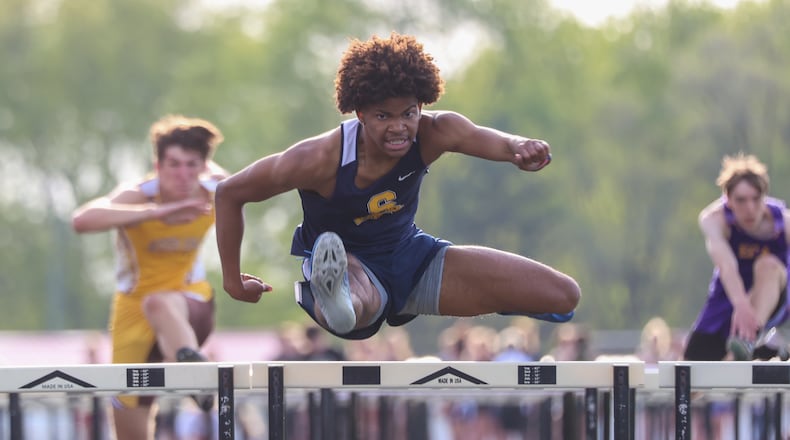 Springfield High School's Jonathon Richardson competes in the 110-meter hurdles at the Clark County Championships on Tuesday evening at Greenon High School. Richardson won both the 110 and 300 hurdles as the Wildcats took home the team championship. Michael Cooper/CONTRIBUTED