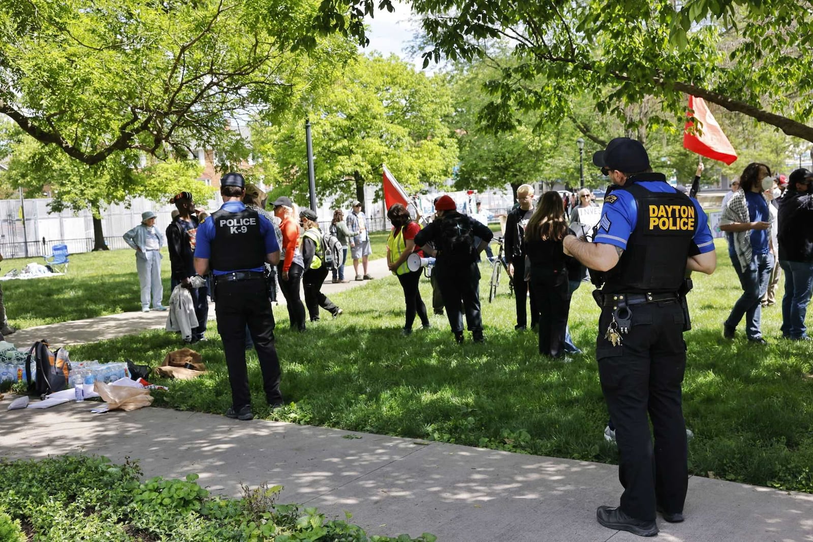 Protestors gathered at Cooper Park behind the Dayton Metro Library Main branch on Saturday, May 24, 2025, down the street from the NATO Parliamentary Assembly. NICK GRAHAM / STAFF