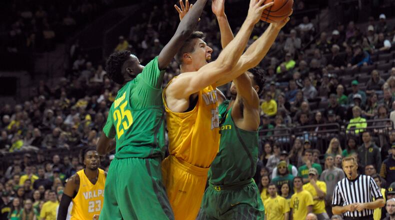 EUGENE, OR - NOVEMBER 17: Alec Peters #25 of the Valparaiso Crusaders drives to the basket on Chris Boucher #25 and Keith Smith #11 of the Oregon Ducks in the second half of the game at Matthew Knight Arena on November 17, 2016 in Eugene, Oregon. Oregon won the game 76-54. (Photo by Steve Dykes/Getty Images)