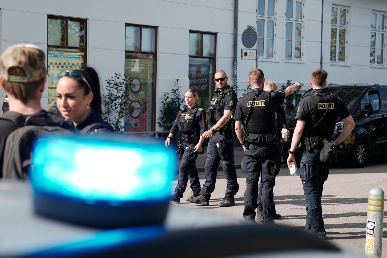 Police and rescue workers on Sortedam Dossering where a car has run into a crowd, Copenhagen, Wednesday, April 30, 2025. (Thomas Traasdahl/Scanpix via AP)