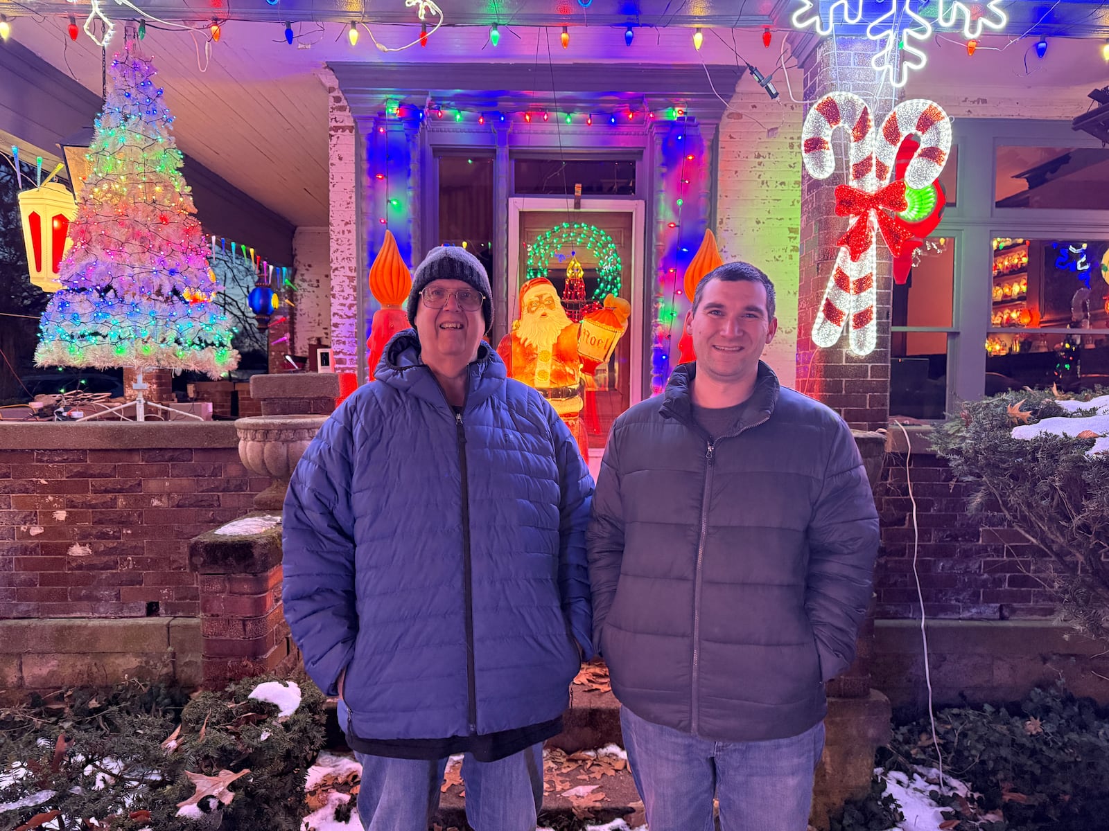 Each holiday season, Richard Smith (left) teams up with his son Alex (right) to put up a massive lights display in front of his home in Piqua. Photos by Alex Cutler