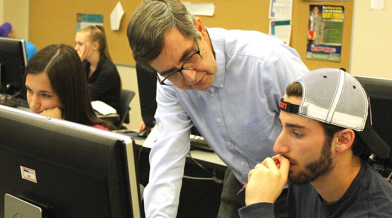Wittenberg professor, Ron Taylor helps a student in a computer science class. JEFF GUERINI/STAFF
