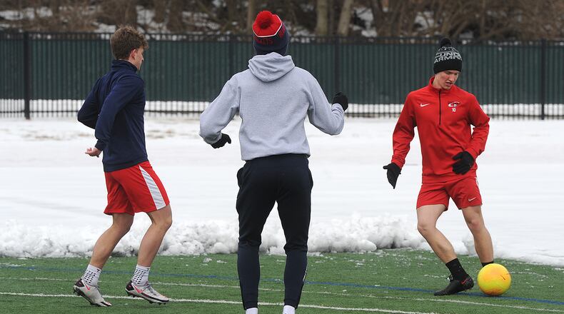 Members of the Oakwood high school soccer team braved the cold Monday, Feb. 22, 2021 to play at Lane Stadium. The team brought shovels to clear the snow off the field.