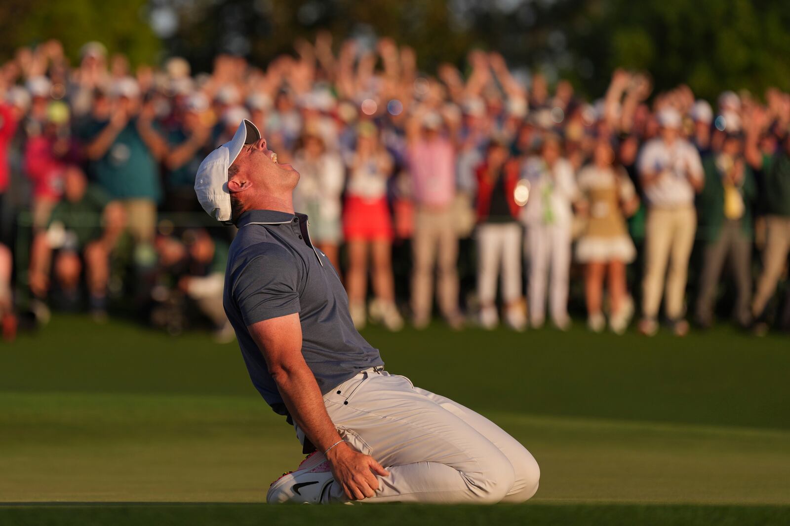 Rory McIlroy, of Northern Ireland, celebrates winning in a playoff against Justin Rose, of England, after the final round the Masters golf tournament, Sunday, April 13, 2025, in Augusta, Ga. (AP Photo/Matt Slocum)