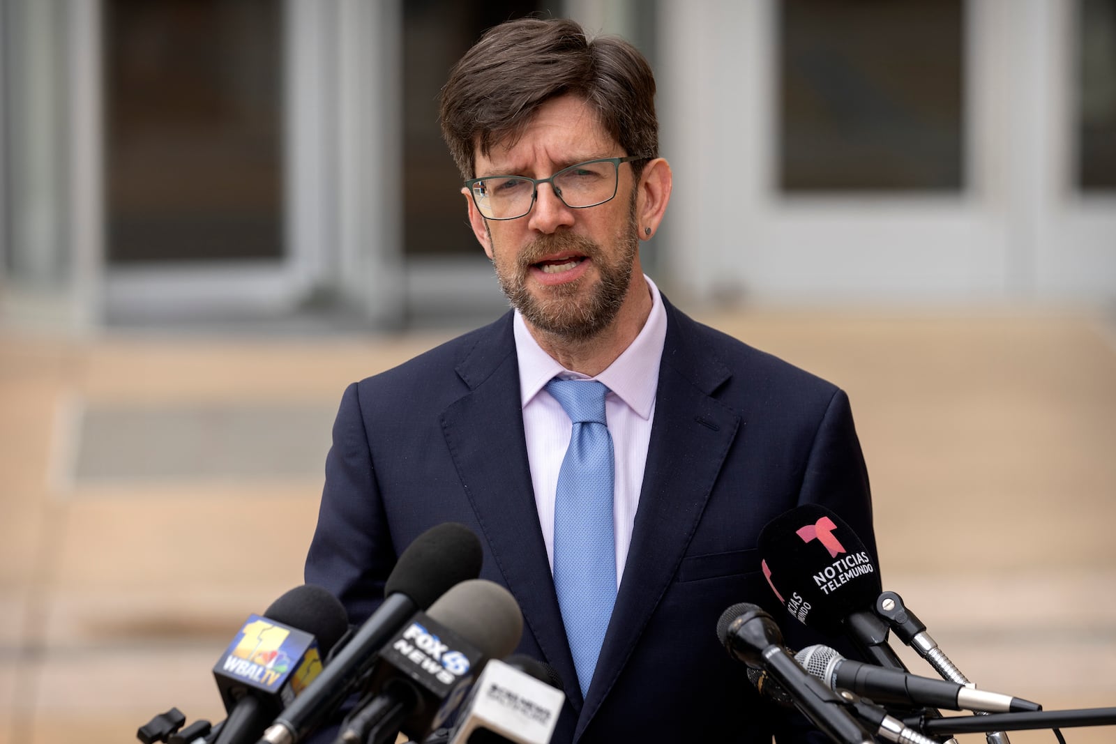 Simon Sandoval-Moshenberg, an attorney for Kilmar Abrego Garcia, speaks to reporters after a hearing at the U.S. District Court in Greenbelt, Md., Monday, July 7, 2025. (AP Photo/Mark Schiefelbein)