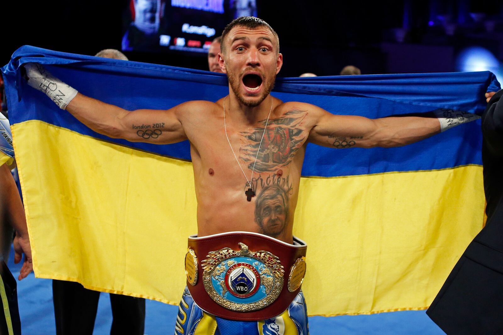 FILE - Vasiliy Lomachenko, of Ukraine, celebrates after defeating Guillermo Rigondeaux in a WBO junior lightweight title boxing match in New York, Dec. 9, 2017. (AP Photo/Adam Hunger, File)