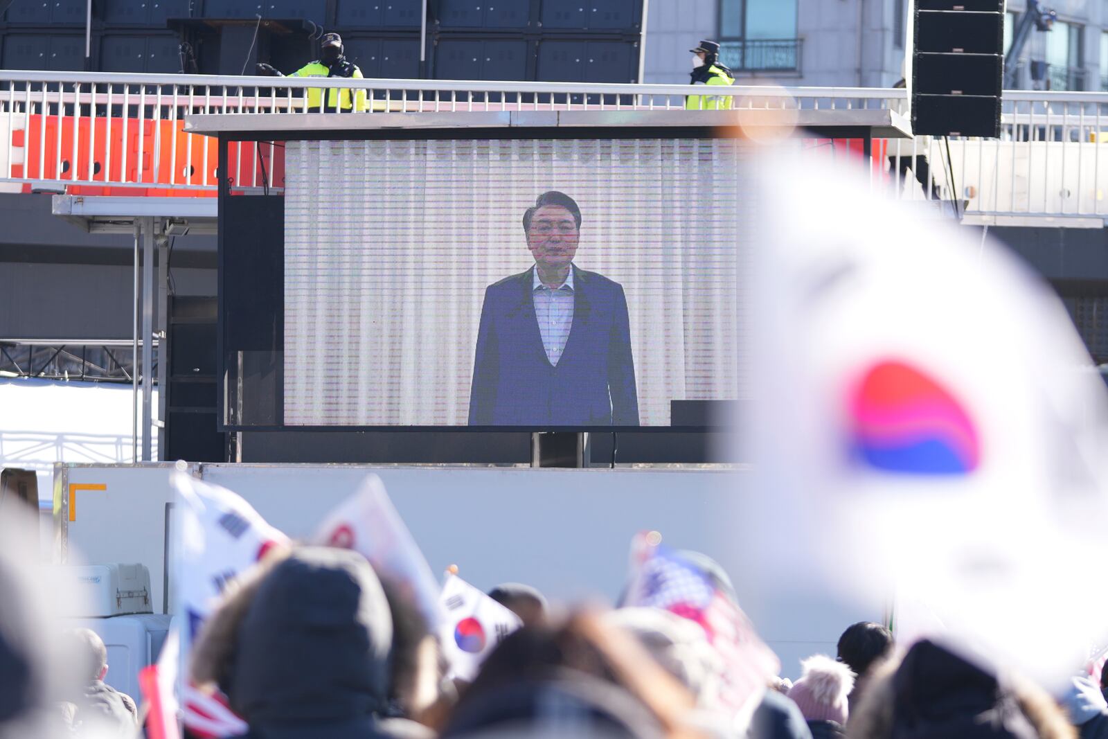 FILE - A huge screen shows a footage of impeached South Korean President Yoon Suk Yeol as supporters stage a rally to oppose his impeachment near the presidential residence in Seoul, South Korea, on Jan. 15, 2025. (AP Photo/Lee Jin-man, File)
